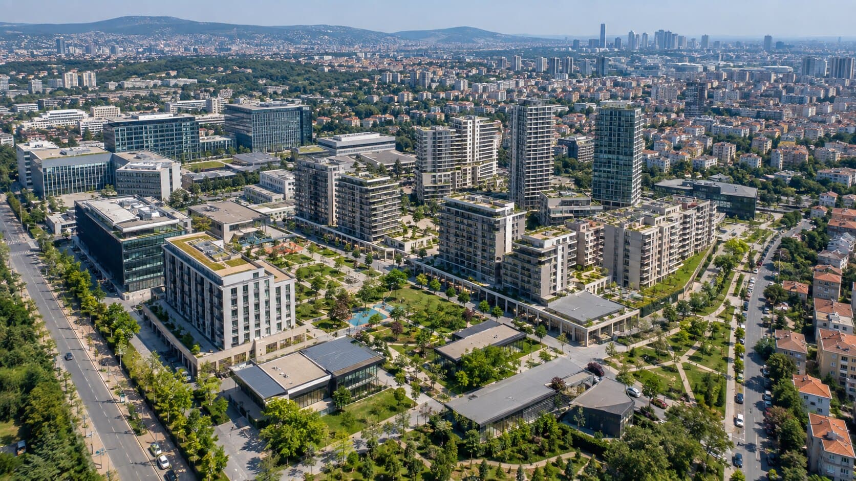 Gündüz çekilmiş peyzajlı karma kullanım yerleşkesi kuşbakışı görünümü